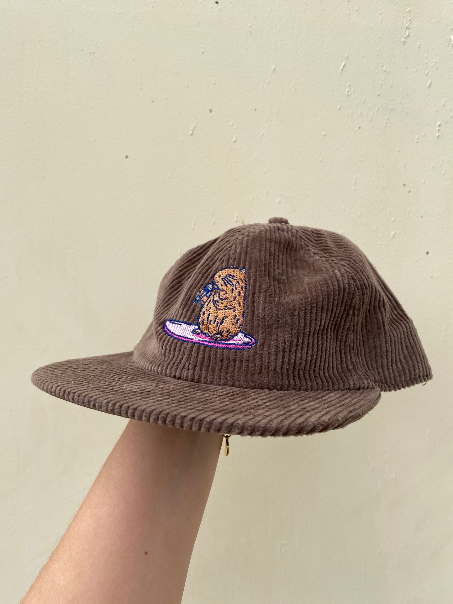 Surfing Capybara Cord Cap