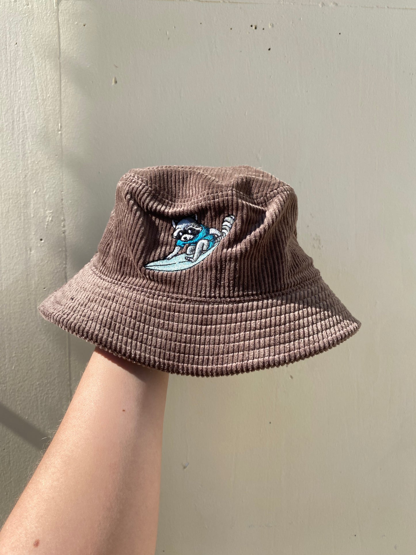 Surfing Raccoon Cord Bucket Hat